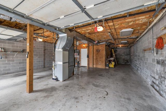 garage with heating unit and gas water heater