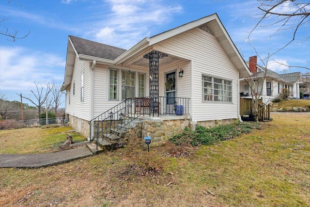 bungalow with a front yard