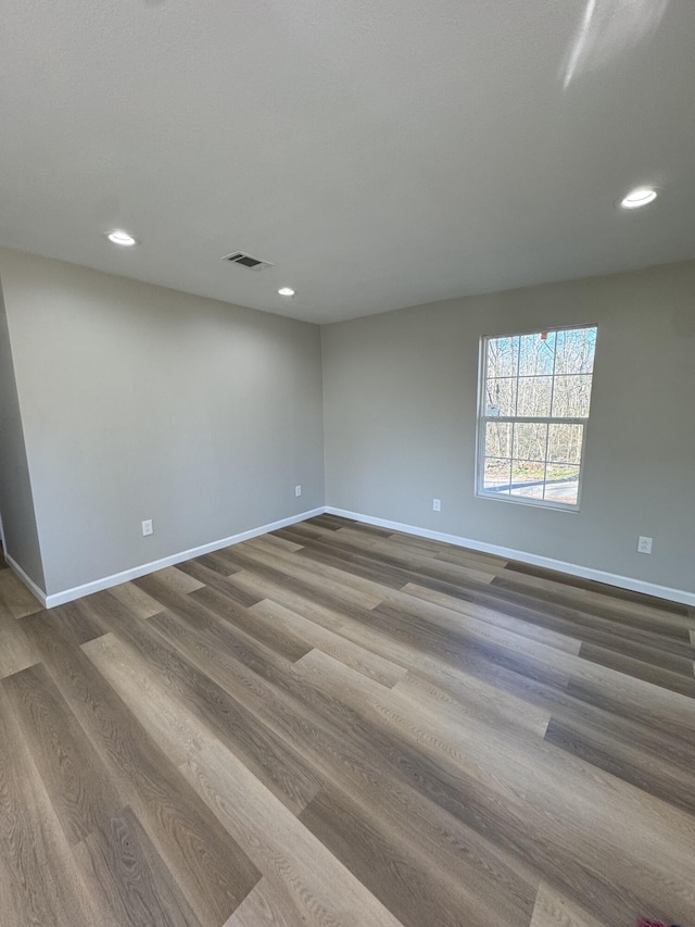 unfurnished room featuring hardwood / wood-style floors