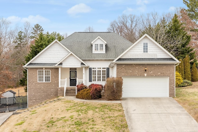 view of front of house featuring a garage and a front yard