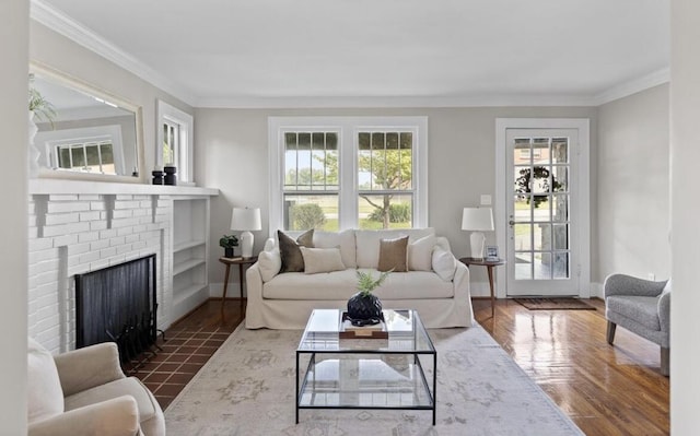 living room with dark hardwood / wood-style flooring, a fireplace, and ornamental molding