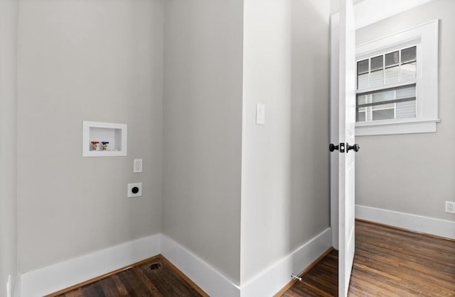 clothes washing area featuring electric dryer hookup, hookup for a washing machine, and hardwood / wood-style flooring