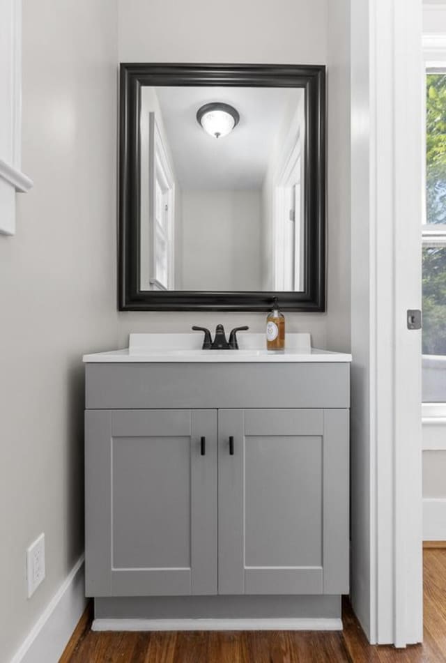 bathroom featuring vanity and hardwood / wood-style floors