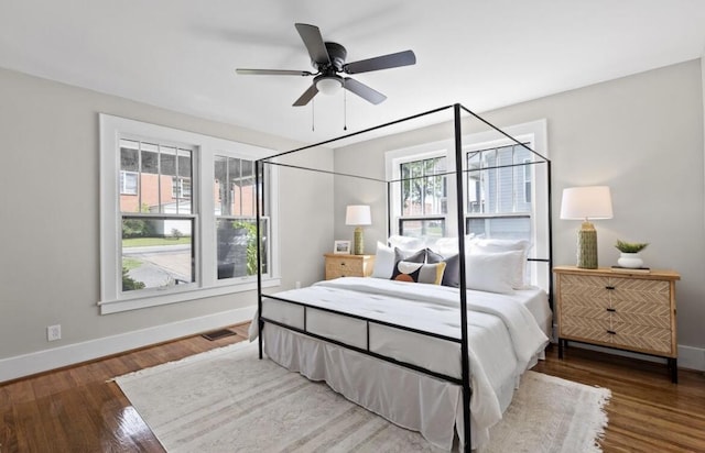 bedroom with wood-type flooring and ceiling fan