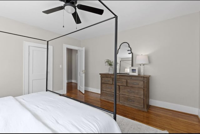 bedroom featuring wood-type flooring and ceiling fan