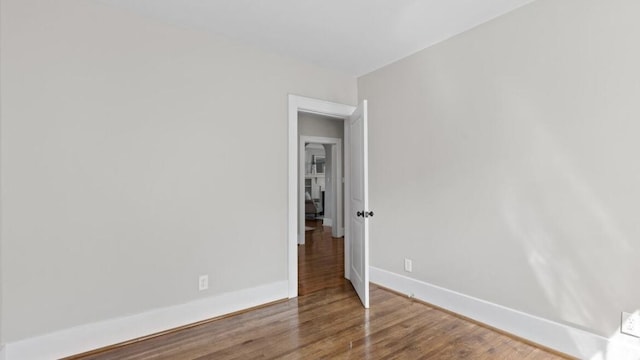 spare room with hardwood / wood-style floors