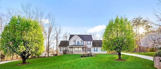 view of front of home featuring a porch and a front lawn