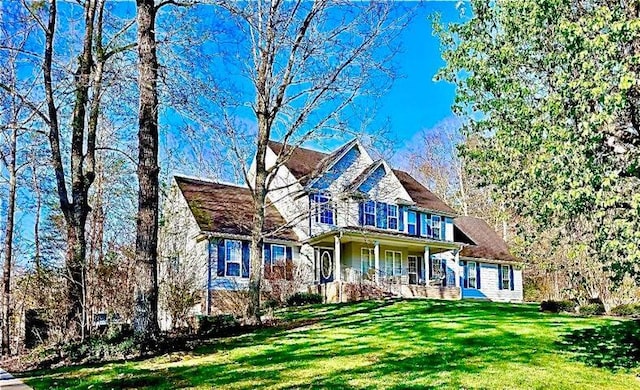 front facade featuring a front yard and a porch