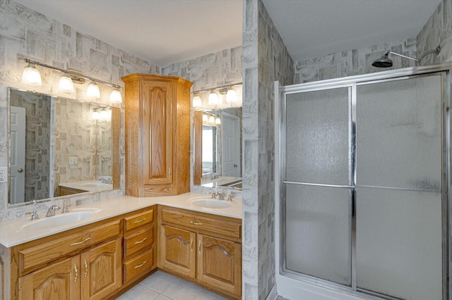 bathroom featuring an enclosed shower, vanity, and tile patterned floors