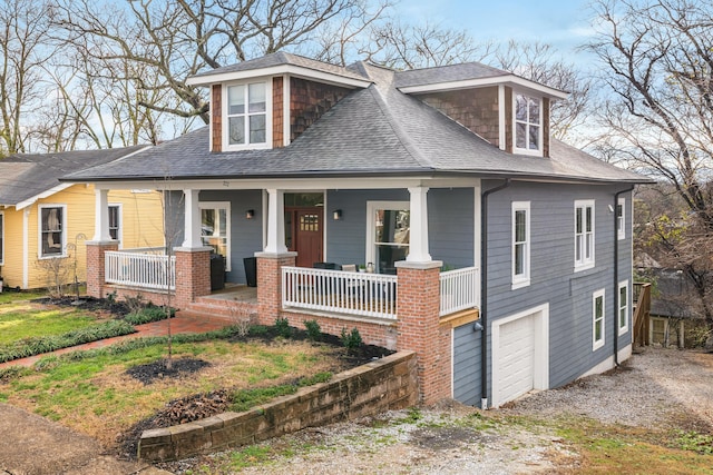 view of front of house with a garage and covered porch