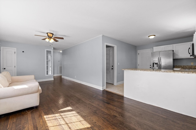 unfurnished living room with hardwood / wood-style flooring and ceiling fan