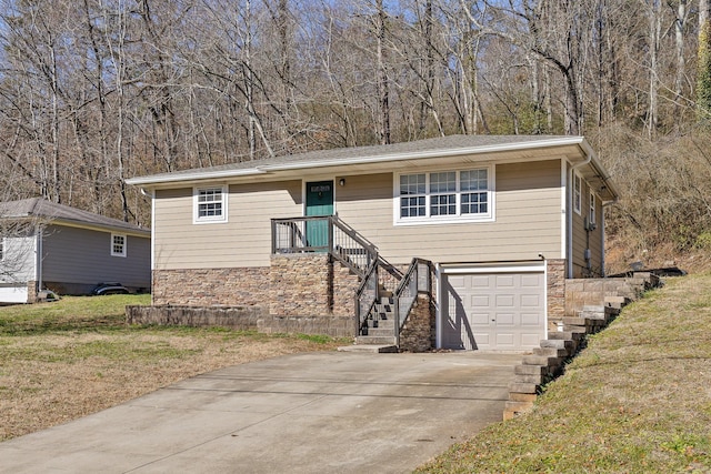 view of front of property with a garage and a front yard