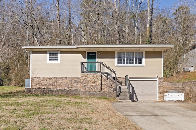 view of front of property with a garage and a front yard