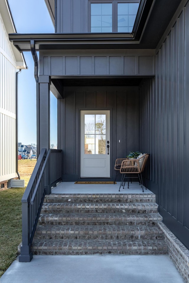 view of exterior entry with a porch