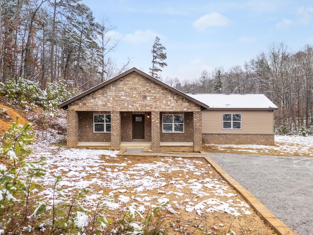 ranch-style home with stone siding and brick siding