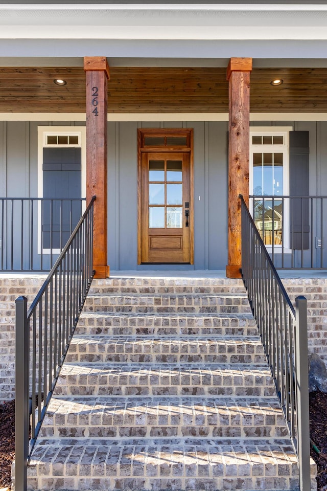 property entrance with covered porch