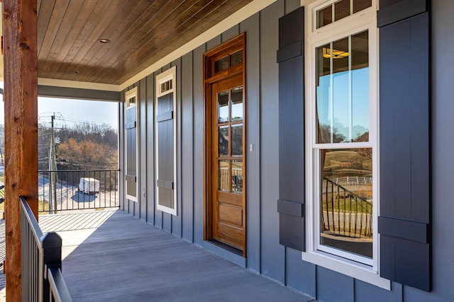 property entrance featuring board and batten siding and a porch