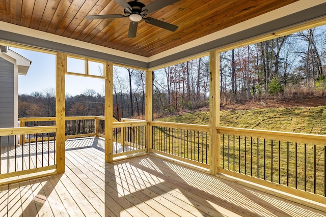 wooden terrace featuring a ceiling fan