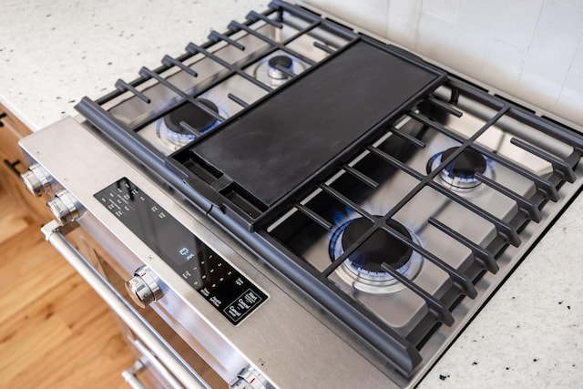 details featuring stainless steel range with gas stovetop