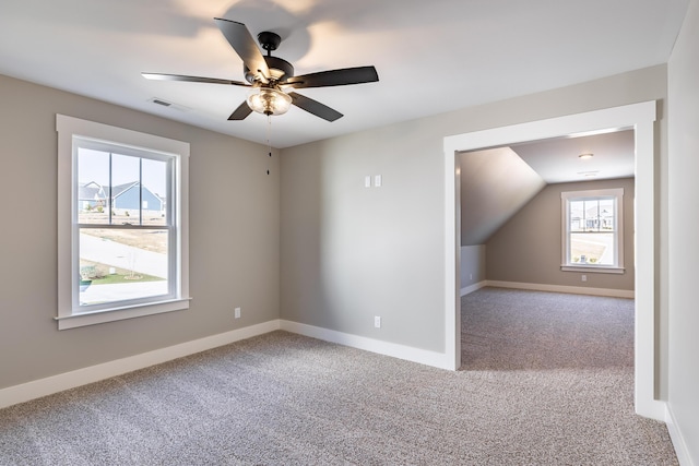 bonus room with baseboards, visible vents, ceiling fan, and carpet flooring