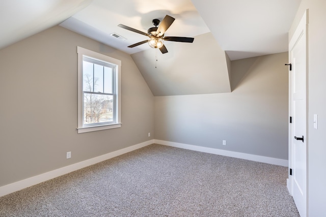 bonus room with carpet, visible vents, vaulted ceiling, and baseboards