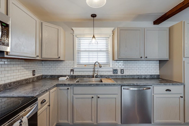 kitchen with sink, decorative light fixtures, appliances with stainless steel finishes, beam ceiling, and backsplash