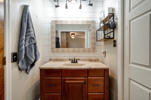 bathroom featuring ceiling fan and vanity