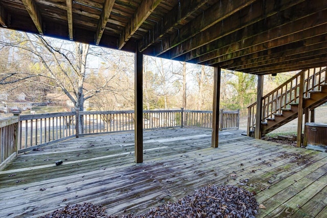 wooden deck featuring cooling unit