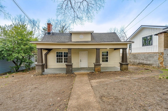 4807 14th Ave, Chattanooga, TN 37407 - bungalow with covered porch, roof with shingles, and a chimney
