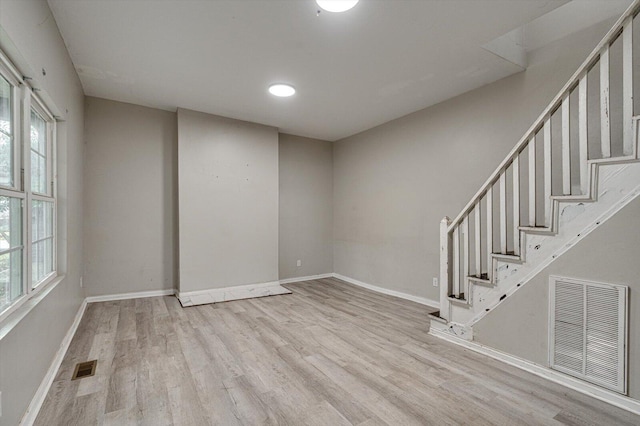 unfurnished room with light hardwood / wood-style flooring