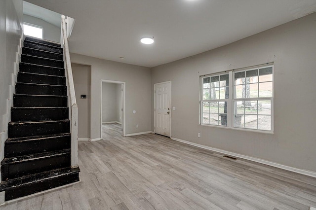 entrance foyer featuring a healthy amount of sunlight and light hardwood / wood-style flooring