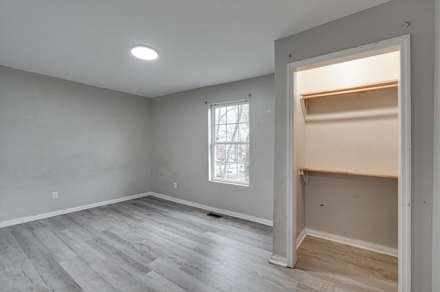 unfurnished bedroom with light hardwood / wood-style flooring