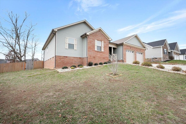 view of front facade with a garage and a front yard