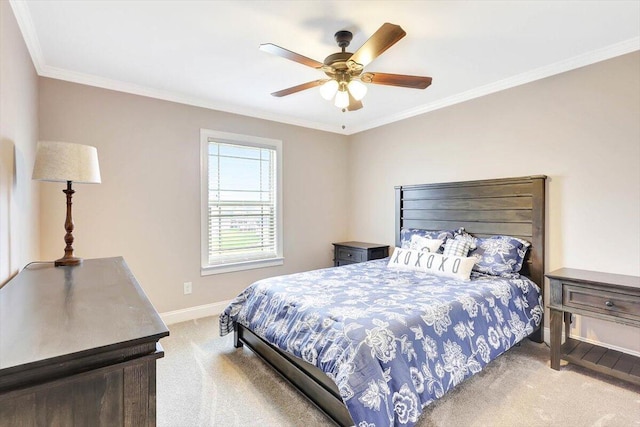 bedroom featuring carpet floors, ornamental molding, and ceiling fan