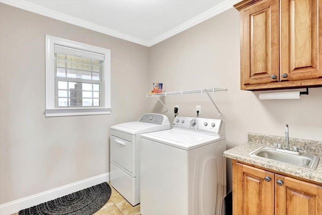 laundry room featuring sink, light tile patterned floors, washer and clothes dryer, cabinets, and ornamental molding