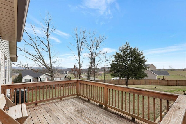 wooden terrace with a yard