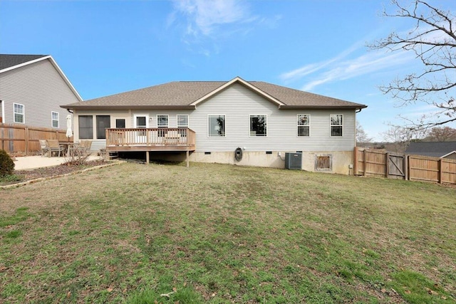 back of property with central AC unit, a yard, a deck, and a patio