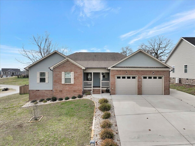 view of front of house featuring a garage, a porch, and a front yard