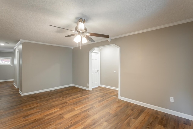 unfurnished room with crown molding, ceiling fan, dark hardwood / wood-style flooring, and a textured ceiling