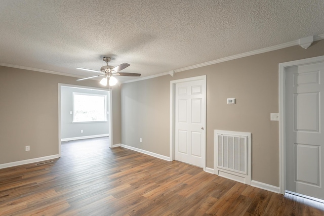 empty room featuring ornamental molding, a textured ceiling, ceiling fan, and dark hardwood / wood-style flooring