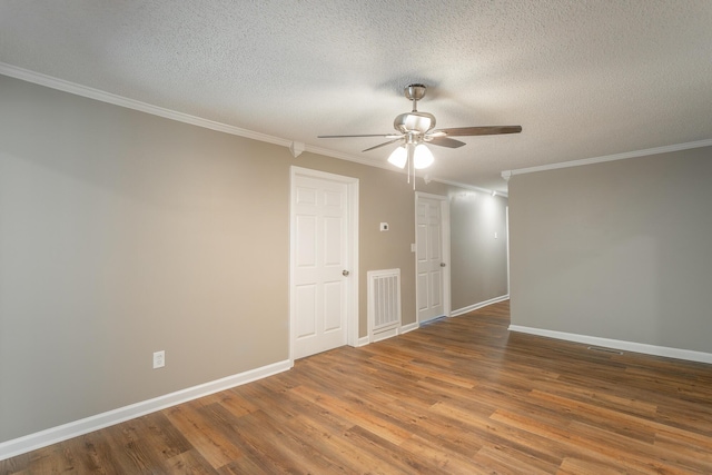 spare room with hardwood / wood-style floors, crown molding, a textured ceiling, and ceiling fan