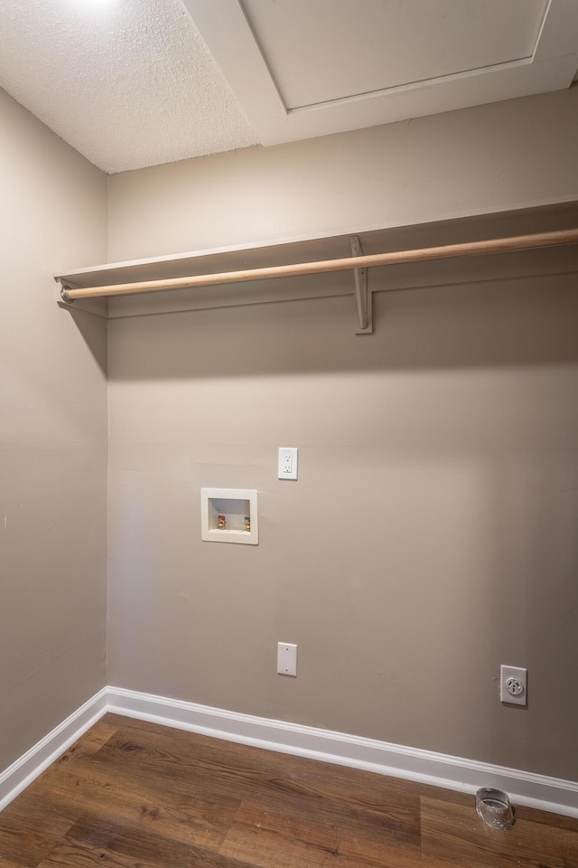 clothes washing area featuring hookup for a washing machine, hardwood / wood-style flooring, and hookup for an electric dryer