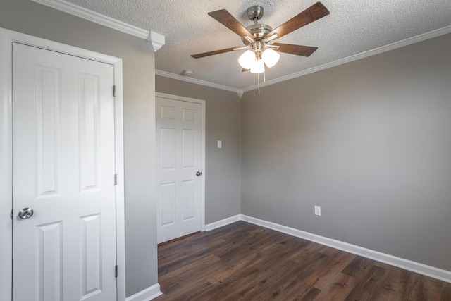 unfurnished bedroom featuring crown molding, ceiling fan, dark hardwood / wood-style floors, and a textured ceiling