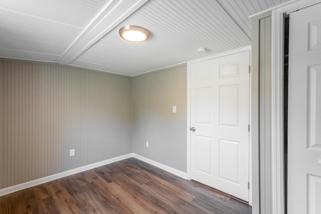 spare room featuring dark hardwood / wood-style flooring