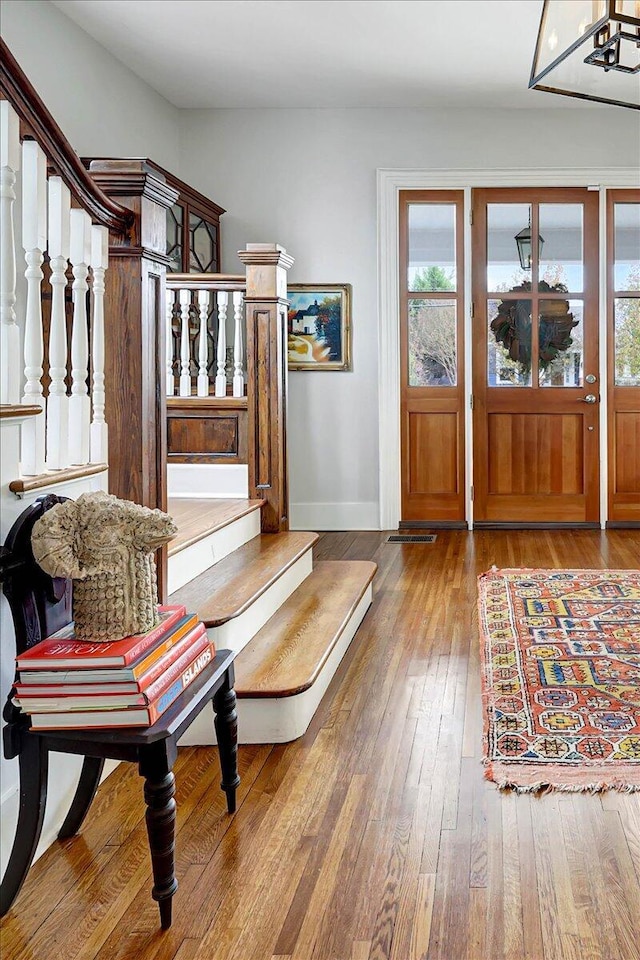 foyer entrance with wood-type flooring