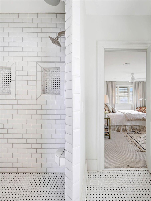 bathroom with ceiling fan, tile patterned floors, and tiled shower