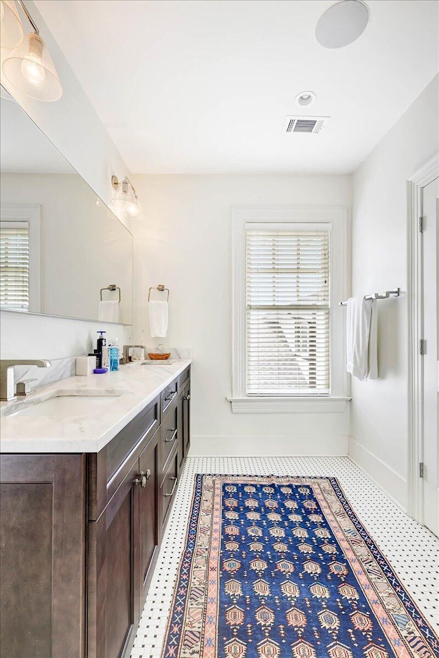 bathroom with vanity and tile patterned flooring