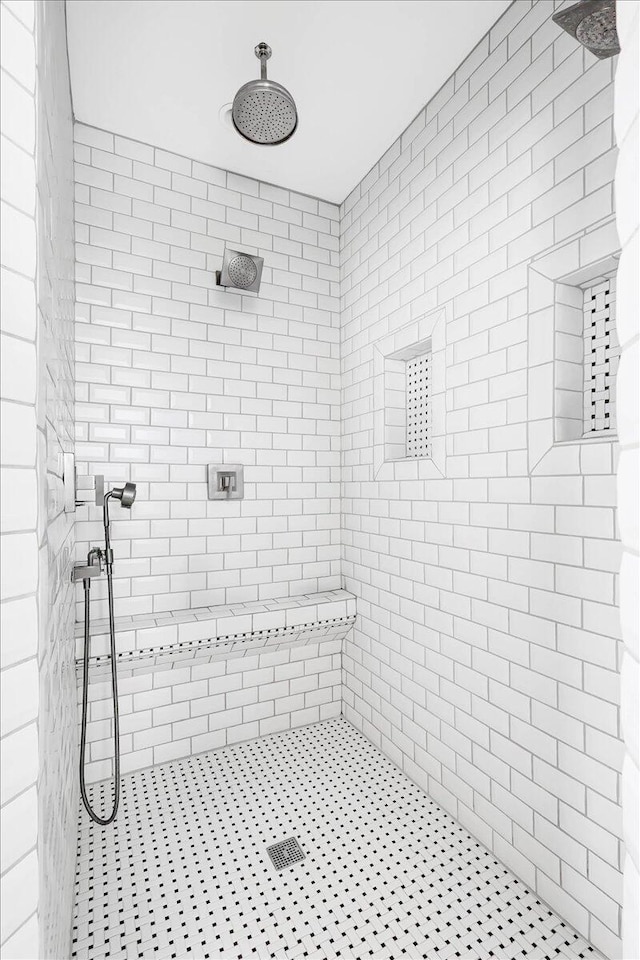 bathroom with tiled shower