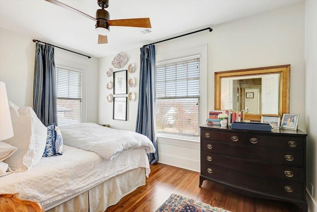 bedroom with ceiling fan and light hardwood / wood-style flooring