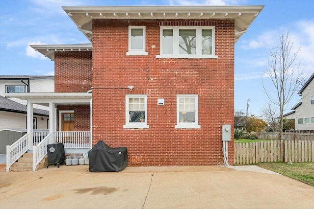 rear view of property featuring a patio area